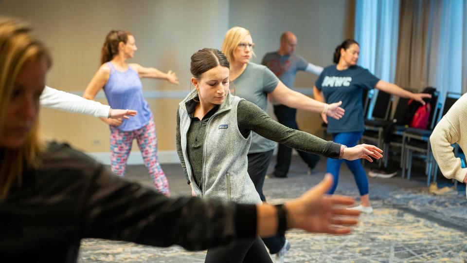 Summit participants during a wellness workshop